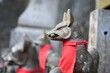 Beautiful shot of stone fox statues in Fushimi Inari shrine cemetery in Kyoto, Japan