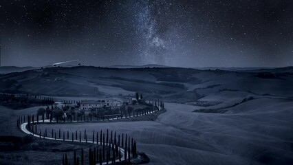 Wall Mural - milky way and winding road with cypressesin italy, timelapse