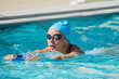 © Michael O'Neill - Teenage athlete doing a kick set in the pool