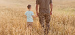 © aprilante - Military man and child holding hands