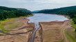 Aerial view of exceptionally low water levels at a reservoir during a heatwave