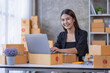 © David - Portrait of young Asian woman SME working with a box at home the workplace.start-up small business owner, small business entrepreneur SME or freelance business online and delivery concept.