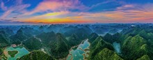 Aerial View Of The Mountains Surrounded By A River At Sunset In Yangshuo County, China