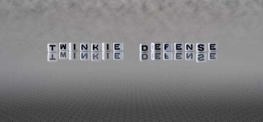 Wall Mural - twinkie defense word or concept represented by black and white letter cubes on a grey horizon background stretching to infinity