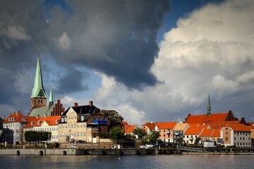 Sticker - Very autumnal looking sky hangs over Helsingor city with a promise of sunshine and showers