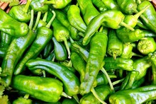 Pile Of Fresh Organic Green Peppers For Sale On A Street Market