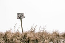 "keep Out Of Dune Area" Sign On A Dry Field