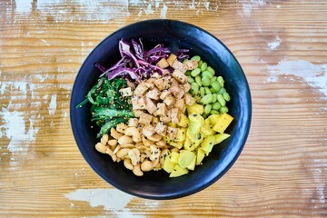 Poster - Top view of the poke with chicken, salmon and avocado