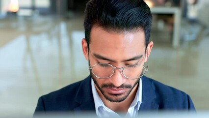 Poster - Focused male copywriter writing a script using a computer inside an office. Serious and professional copy editor researching a novel online. Creative blogger typing an article and wearing glasses