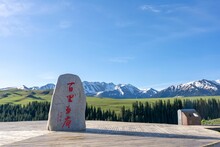 Memorial Stone In Grassland And Mountains In The Morning