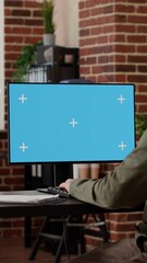 Poster - vertical video: office employee typing on computer with greenscreen, working with isolated chroma ke