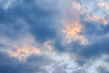 Wall Mural - Sky background with sunlight through clouds at sunset