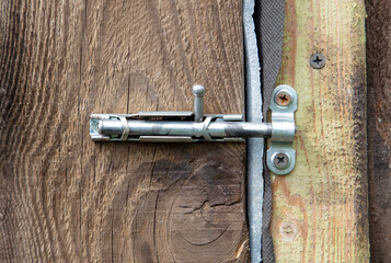 Wall Mural - A latch on an old wooden door.