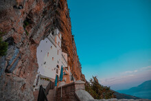 Evening View Of Ostrog Orthodox Monastery In Montenegro Or Crna Gora, Popular Pilgrimage Point In The Balkans, Viewed From Frog Perspective In Sunny Evening.