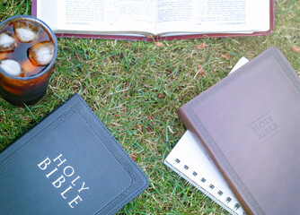 Wall Mural - A Small Group Bible Study Outside on the Green Grass