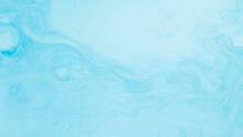 Fluid Background Blue Turquoise Color. Creative Fluid Art Sky Hues Background. Blue Spots Of Paint On Liquid