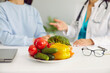 © Studio Romantic - Fresh healthy vegetables in plate cucumbers, tomatoes and bell peppers containing vitamins on table of nutritionist doctor symbolize benefits of proper nutrition and vegetarianism. Selective focus