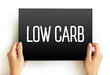 Low Carb - diet means that you eat fewer carbohydrates and a higher proportion of protein and fat, text concept on card