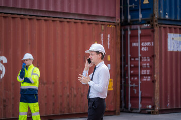 Poster - Businessman having discussion with the manager at container yard warehouse,Manager and customer checking on shipping containers,Logistic and business export.