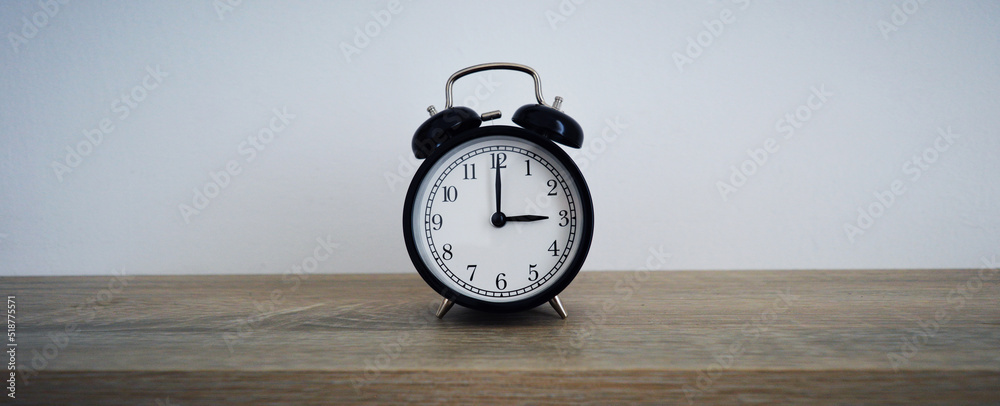 Analog alarm clock pointing at hours, minutes, seconds to display time ...