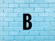 Letter B On Blue Brick Wall