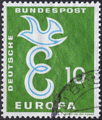 Wall Mural - Germany - circa 1958: a postage stamp from Germany , showing a capital E and a dove on it as a community issue from European states. Text: Europe