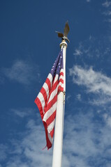 American flag against the blue sky