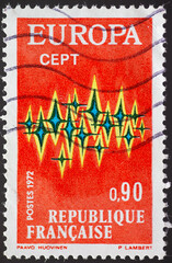 Wall Mural - FRANCE - CIRCA 1972: a postage stamp from FRANCE, showing a symbol with stars as a symbol of solidarity within Europe. Text: EuropeCEPT. Circa 1972