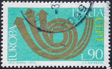 Wall Mural - ITALY - CIRCA 1973: a postage stamp from ITALY , showing a stylized post horn. Text: Europe, CEPT. Circa 1973