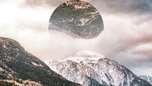 Abstract Mountains Covered With Green Forest And Snow, Big Circle With The Landscape Reflection Upside Down. Mountainous Landscape And A Circle With Mountains Reflection, Nature And Geometry Concept.