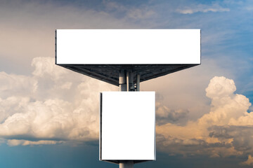 two blank white billboards against warm sunset sky with clouds - front view, mock up. consumerism, a