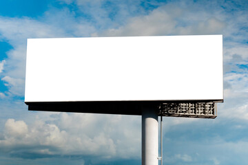 blank wide large display or white billboard against blue sky with white clouds - mock up. template, 