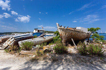 Naklejka na meble broken boats on the shore, Losinj town, Croatia.