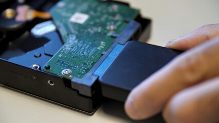 Poster - Concept of neuronet and computer technologies. Media. Close up of connecting an external adapter to a computer circuit board on white table background.