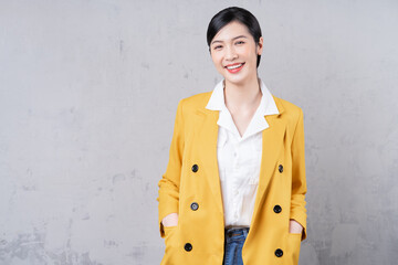 Portrait of young Asian businesswoman on background