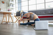 © todja - young asian woman working out and doing yoga with laptop at home, healthy concept.