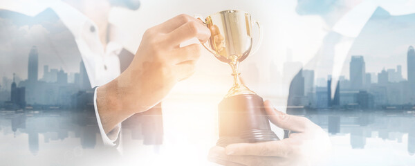 Wall Mural - success business and achievement team concept, successful businessman holding champion award of winn