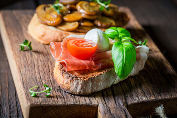 Wall Mural - Crisp and hot various bruschetta as classic snack for breakfast.