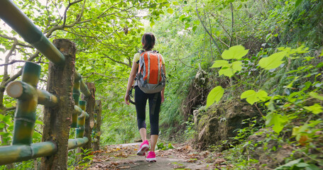 woman walk on mountain stairs