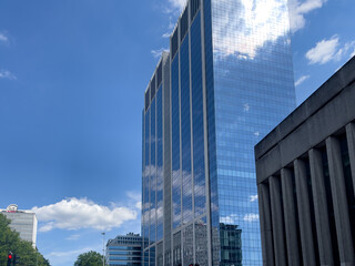 High building with blue sky reflection on the glass