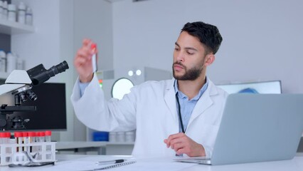 Aufkleber - Biologist working with blood collection tubes data and typing information on a laptop. One young male chemist, scientist or healthcare professional doing lab report testing and analyzing samples