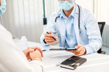 Wall Mural - Doctors and patients sit and talk to the patient about medication in the hospital.