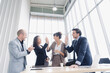 © Danai - Diversity group of business people smiling happy celebrating success work in modern office
