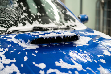 car cleaning in the workshop. applying foam on the machine