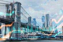 Brooklyn Bridge With New York City Manhattan, Financial Downtown Skyline Panorama At Day Time Over East River. Forex Graph Hologram. The Concept Of Internet Trading, Brokerage And Fundamental Analysis