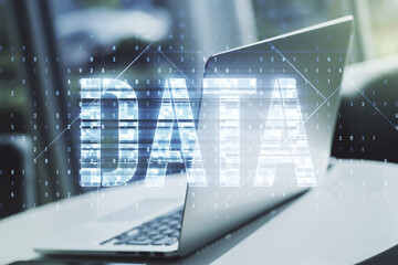 Poster - Creative Data word sign on modern laptop background. Multiexposure