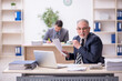 © Elnur - Two male employees working in the office