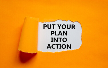 Wall Mural - Put your plan into action symbol. Concept words Put your plan into action on white paper on a beautiful orange background. Business planning and put your plan into action concept. Copy space.