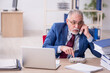 © Elnur - Old male employee and too much work in the office