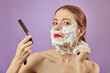 © tugolukof - woman shaves her face
